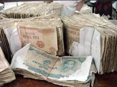 Chiêm bao tiền lẻ bị rách